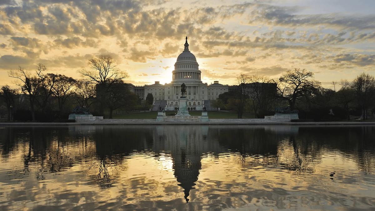 US Capitol Building with sunrise sky